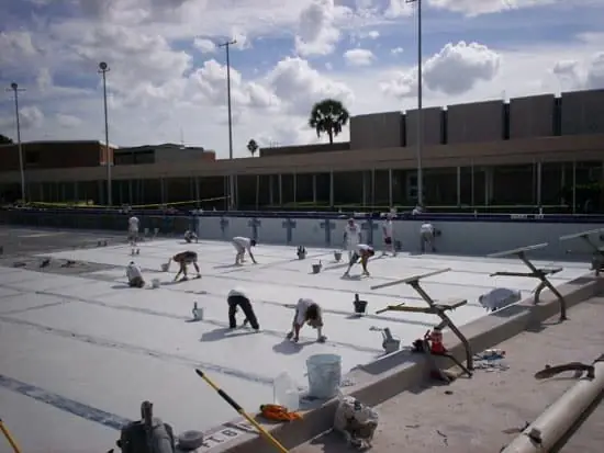 Classic Marcite crew resurfacing a large commercial pool