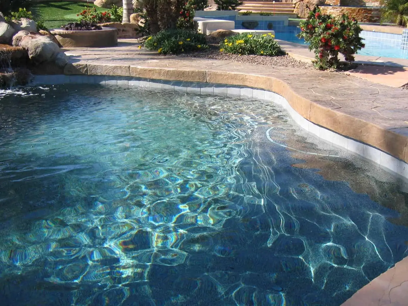 Freeform pool with a rock edge and new interior finish