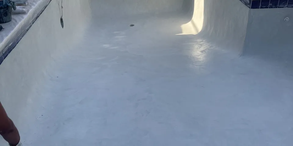 Freshly plastered pool inside a screen enclosure