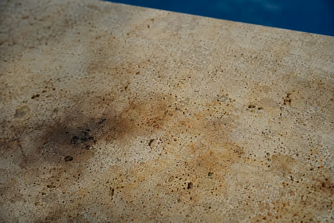 Close-up of travertine stain marks and pores
