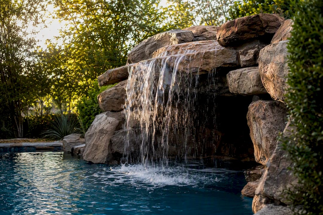 Residential pool rock waterfall and grotto feature